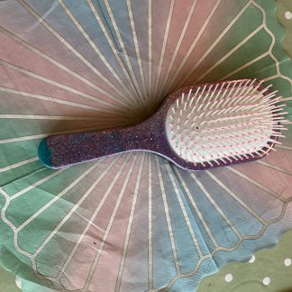 purple hair brush