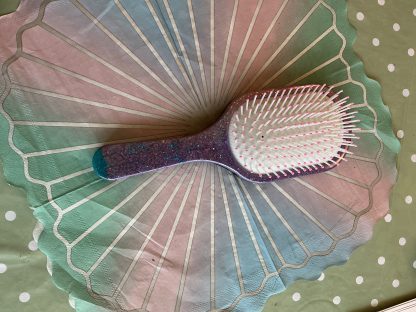purple hair brush