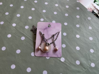 Pearl set on mother of pearl