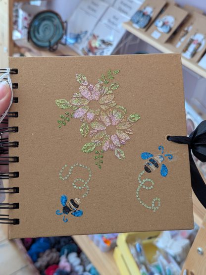 book flower with bee