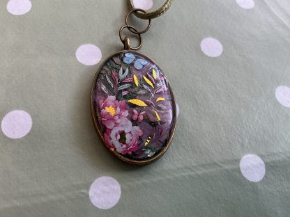 Floral oval butterfly necklace