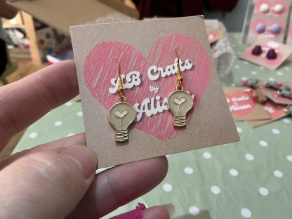 pink light bulb earrings